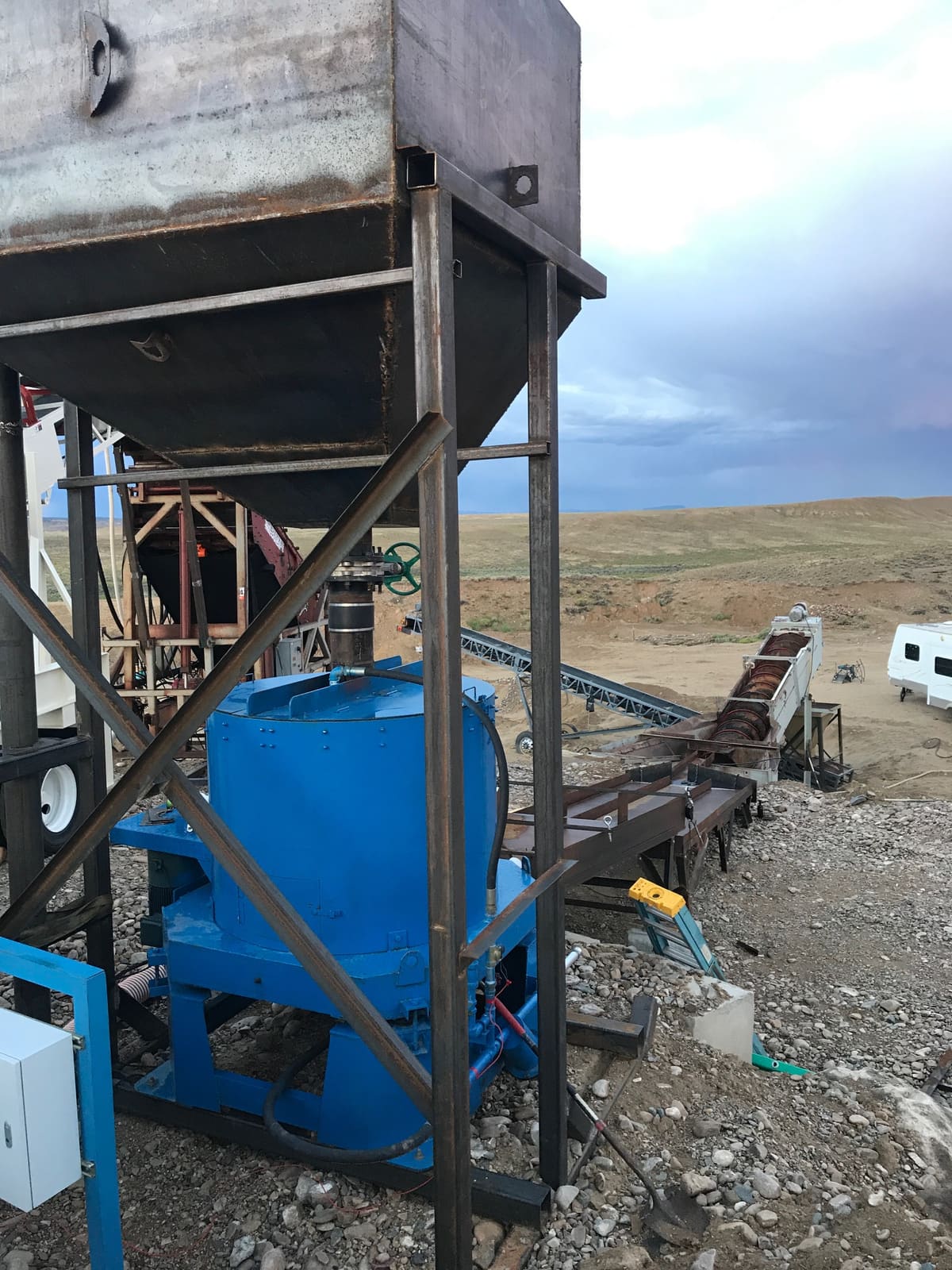 A blue centrifugal concentrator bowl in the wash plant, used to capture heavy minerals from slurry.